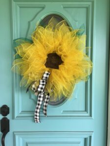 Hang finished wreath on door with command hook. 